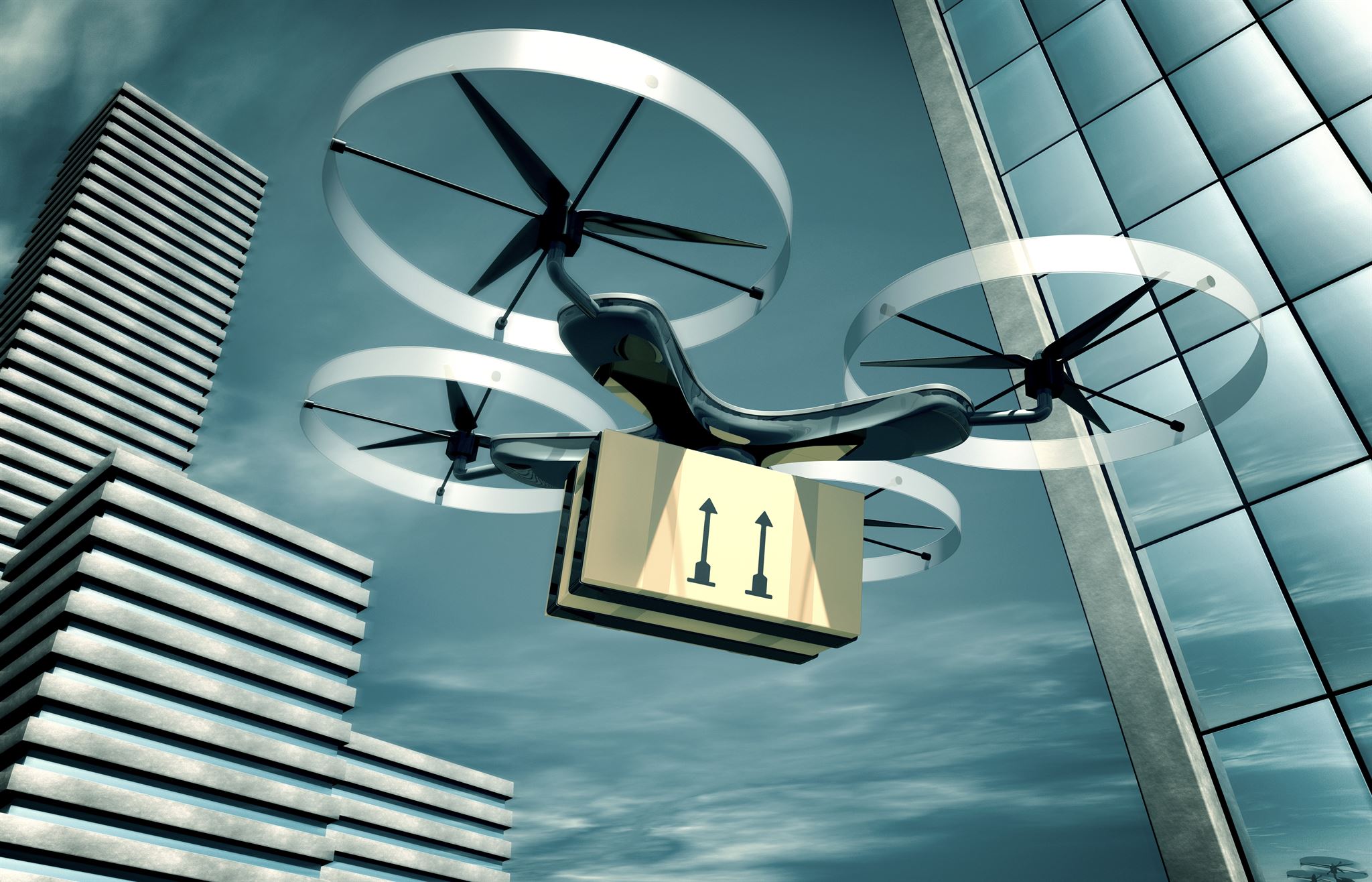 Drone-carrying-a-parcel-among-modern-buildings